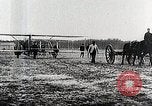 Image of Wilbur Wright adjusting transporter wheel on flyer United States USA, 1908, second 31 stock footage video 65675027433