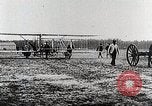 Image of Wilbur Wright adjusting transporter wheel on flyer United States USA, 1908, second 33 stock footage video 65675027433