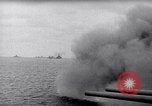 Image of US Naval guns fire overhead during amphibious assault on Iwo Jima Iwo Jima, 1945, second 9 stock footage video 65675027605
