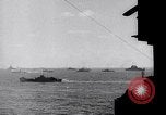 Image of US Naval guns fire overhead during amphibious assault on Iwo Jima Iwo Jima, 1945, second 34 stock footage video 65675027605
