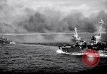 Image of US Naval guns fire overhead during amphibious assault on Iwo Jima Iwo Jima, 1945, second 36 stock footage video 65675027605