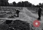 Image of Secretary of State Cordell Hull visits U.S. 4th Division Cemetery Normandy France, 1944, second 10 stock footage video 65675027617