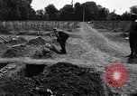 Image of Secretary of State Cordell Hull visits U.S. 4th Division Cemetery Normandy France, 1944, second 12 stock footage video 65675027617