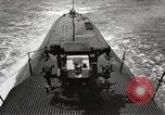 Image of five inch twenty five caliber gun firing after sub surfaces United States USA, 1945, second 8 stock footage video 65675027732