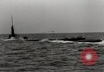 Image of five inch twenty five caliber gun firing after sub surfaces United States USA, 1945, second 29 stock footage video 65675027732