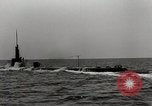 Image of five inch twenty five caliber gun firing after sub surfaces United States USA, 1945, second 30 stock footage video 65675027732