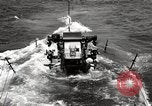 Image of five inch twenty five caliber gun firing after sub surfaces United States USA, 1945, second 31 stock footage video 65675027732