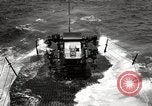 Image of five inch twenty five caliber gun firing after sub surfaces United States USA, 1945, second 33 stock footage video 65675027732