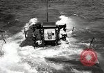 Image of five inch twenty five caliber gun firing after sub surfaces United States USA, 1945, second 34 stock footage video 65675027732