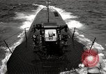 Image of five inch twenty five caliber gun firing after sub surfaces United States USA, 1945, second 39 stock footage video 65675027732