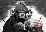 Image of five inch twenty five caliber gun firing after sub surfaces United States USA, 1945, second 44 stock footage video 65675027732