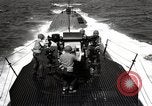 Image of five inch twenty five caliber gun firing after sub surfaces United States USA, 1945, second 45 stock footage video 65675027732