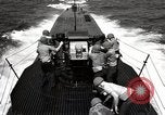 Image of five inch twenty five caliber gun firing after sub surfaces United States USA, 1945, second 49 stock footage video 65675027732