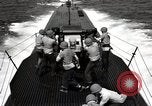 Image of five inch twenty five caliber gun firing after sub surfaces United States USA, 1945, second 50 stock footage video 65675027732