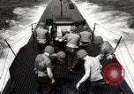 Image of five inch twenty five caliber gun firing after sub surfaces United States USA, 1945, second 55 stock footage video 65675027732
