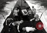 Image of five inch twenty five caliber gun firing after sub surfaces United States USA, 1945, second 57 stock footage video 65675027732