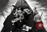Image of five inch twenty five caliber gun firing after sub surfaces United States USA, 1945, second 62 stock footage video 65675027732