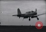 Image of SB2U crash landing on CV-7 USS Wasp Pacific Theater, 1942, second 5 stock footage video 65675027782