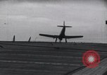 Image of SB2U crash landing on CV-7 USS Wasp Pacific Theater, 1942, second 16 stock footage video 65675027782