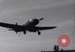 Image of SB2U landing on CV-7 USS Wasp Pacific Theater, 1942, second 15 stock footage video 65675027784