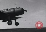Image of SB2U landing on CV-7 USS Wasp Pacific Theater, 1942, second 20 stock footage video 65675027784