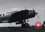 Image of SB2U landing on CV-7 USS Wasp Pacific Theater, 1942, second 22 stock footage video 65675027784