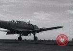Image of SB2U landing on CV-7 USS Wasp Pacific Theater, 1942, second 27 stock footage video 65675027784