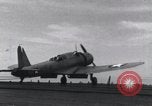 Image of SB2U landing on CV-7 USS Wasp Pacific Theater, 1942, second 30 stock footage video 65675027784