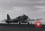 Image of SB2U landing on CV-7 USS Wasp Pacific Theater, 1942, second 31 stock footage video 65675027784
