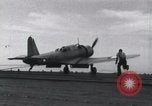 Image of SB2U landing on CV-7 USS Wasp Pacific Theater, 1942, second 34 stock footage video 65675027784