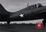 Image of F4F landing on USS Wasp Pacific Theater, 1942, second 18 stock footage video 65675027785