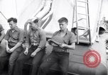 Image of Sailors are issued combat helmets aboard the USS Nelson  Atlantic Ocean, 1943, second 18 stock footage video 65675027935