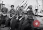 Image of Sailors are issued combat helmets aboard the USS Nelson  Atlantic Ocean, 1943, second 21 stock footage video 65675027935