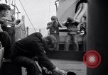 Image of Sailors are issued combat helmets aboard the USS Nelson  Atlantic Ocean, 1943, second 49 stock footage video 65675027935