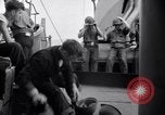 Image of Sailors are issued combat helmets aboard the USS Nelson  Atlantic Ocean, 1943, second 51 stock footage video 65675027935