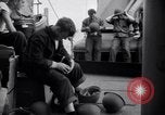 Image of Sailors are issued combat helmets aboard the USS Nelson  Atlantic Ocean, 1943, second 52 stock footage video 65675027935