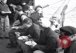 Image of Crew of USCGC Campbell have lunch on deck Nova Scotia, 1943, second 3 stock footage video 65675027942