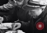 Image of Crew of USCGC Campbell have lunch on deck Nova Scotia, 1943, second 13 stock footage video 65675027942