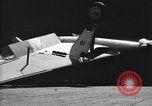 Image of SB2C airplane crashes while landing on USS Bunker Hill Pacific Theater, 1944, second 35 stock footage video 65675027955