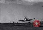 Image of F4U aircraft noses over during landing on USS Bunker Hill Pacific Theater, 1944, second 4 stock footage video 65675027958