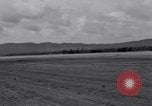 Standbild zerstörten Waffen und Flugzeugen Guam, 1944, aus Sekunde 18 historischem Filmmaterial Videoclip 65675028023