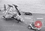 Image of Handling of jet aircraft on carrier flight deck United States USA, 1951, second 57 stock footage video 65675028028