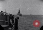 Standbild OS2U Kingfisher scout Wasserflugzeug landet in Wasser Majuro Marshall Inseln, 1944, aus Sekunde 1 historischem Filmmaterial Videoclip 65675028036