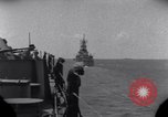 Standbild OS2U Kingfisher scout Wasserflugzeug landet in Wasser Majuro Marshall Inseln, 1944, aus Sekunde 3 historischem Filmmaterial Videoclip 65675028036