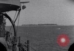 Standbild OS2U Kingfisher scout Wasserflugzeug landet in Wasser Majuro Marshall Inseln, 1944, aus Sekunde 4 historischem Filmmaterial Videoclip 65675028036