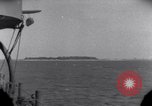 Standbild OS2U Kingfisher scout Wasserflugzeug landet in Wasser Majuro Marshall Inseln, 1944, aus Sekunde 5 historischem Filmmaterial Videoclip 65675028036