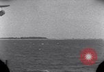 Standbild OS2U Kingfisher scout Wasserflugzeug landet in Wasser Majuro Marshall Inseln, 1944, aus Sekunde 6 historischem Filmmaterial Videoclip 65675028036