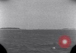 Standbild OS2U Kingfisher scout Wasserflugzeug landet in Wasser Majuro Marshall Inseln, 1944, aus Sekunde 8 historischem Filmmaterial Videoclip 65675028036