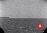Standbild OS2U Kingfisher scout Wasserflugzeug landet in Wasser Majuro Marshall Inseln, 1944, aus Sekunde 9 historischem Filmmaterial Videoclip 65675028036