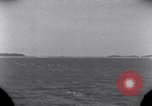 Standbild OS2U Kingfisher scout Wasserflugzeug landet in Wasser Majuro Marshall Inseln, 1944, aus Sekunde 10 historischem Filmmaterial Videoclip 65675028036